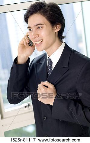 Stock Photo - Close-up of a businessman talking on a mobile phone. Fotosearch