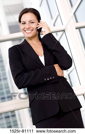Portrait of a businesswoman talking on a mobile phone View Large Photo Image Stock Image - Portrait of a businesswoman talking on a mobile phone. Fotosearch