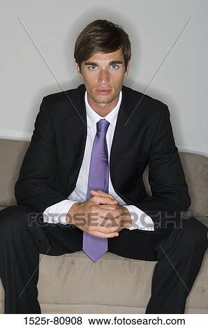 Portrait of a businessman looking serious View Large Photo Image Stock Photo - Portrait of a businessman looking serious. Fotosearch