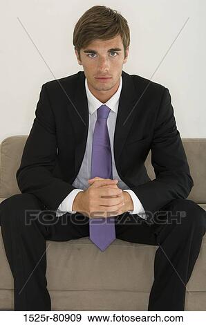 Portrait of a businessman looking serious View Large Photo Image Stock Photo - Portrait of a businessman looking serious. Fotosearch