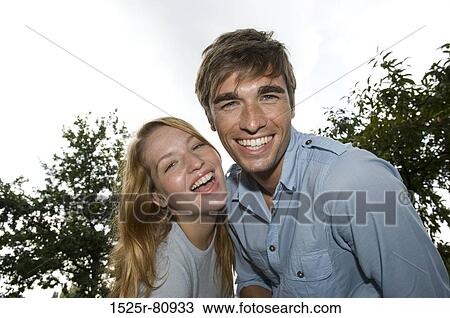 Portrait of a young couple smiling View Large Photo Image Stock Image - Portrait of a young couple smiling. Fotosearch