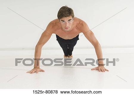 Portrait of a young man doing push-ups View Large Photo Image Stock Photo - Portrait of a young man doing push-ups. Fotosearch