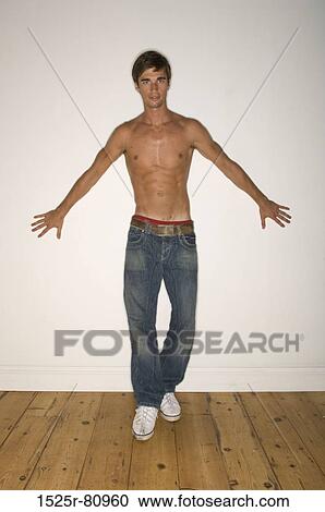 Portrait of a young man leaning against a wall View Large Photo Image Stock Image - Portrait of a young man leaning against a wall. Fotosearch