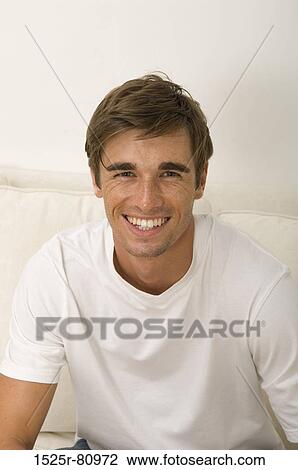 Portrait of a young man smiling View Large Photo Image Stock Image - Portrait of a young man smiling. Fotosearch