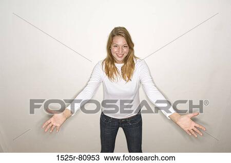 Stock Image - Portrait of a young woman gesturing. Fotosearch
