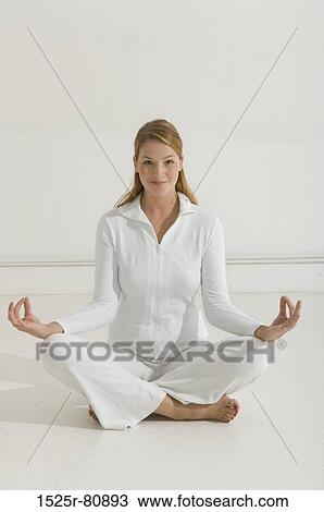 Portrait of a young woman practicing yoga View Large Photo Image Stock Image - Portrait of a young woman practicing yoga. Fotosearch