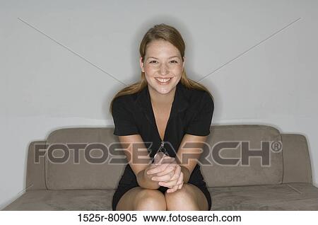 Portrait of a young woman smiling View Large Photo Image Stock Photography - Portrait of a young woman smiling. Fotosearch