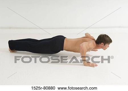 Side profile of a young man doing push-ups View Large Photo Image Stock Image - Side profile of a young man doing push-ups. Fotosearch