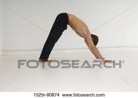 Side profile of a young man exercising View Large Photo Image Picture - Side profile of a young man exercising. Fotosearch