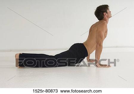 Side profile of a young man exercising View Large Photo Image Stock Image - Side profile of a young man exercising. Fotosearch