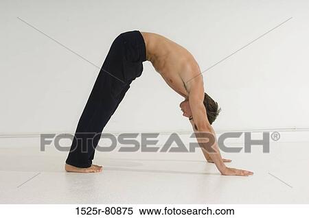 Side profile of a young man exercising View Large Photo Image Stock Photography - Side profile of a young man exercising. Fotosearch