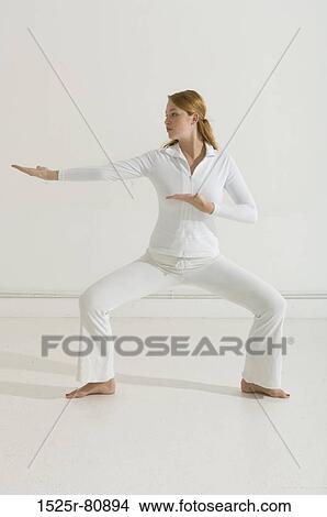 Young woman exercising View Large Photo Image Picture - Young woman exercising. Fotosearch