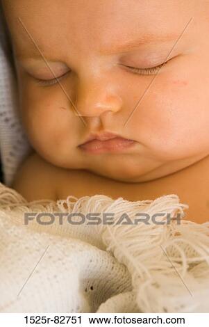 Stock Image - Close-up of a baby sleeping. Fotosearch