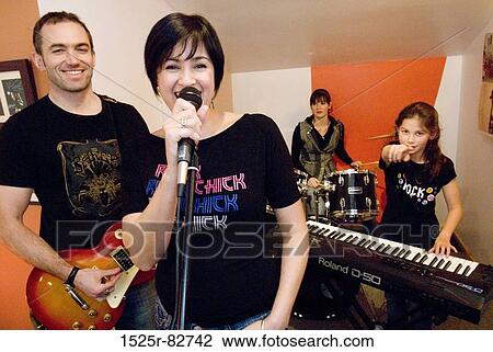 Family performing in a musical band View Large Photo Image Stock Image - Family performing in a musical band. Fotosearch