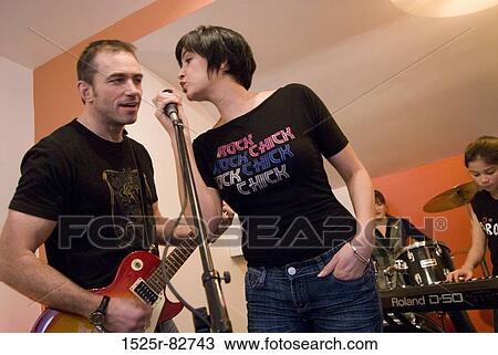 Family performing in a musical band View Large Photo Image Stock Image - Family performing in a musical band. Fotosearch