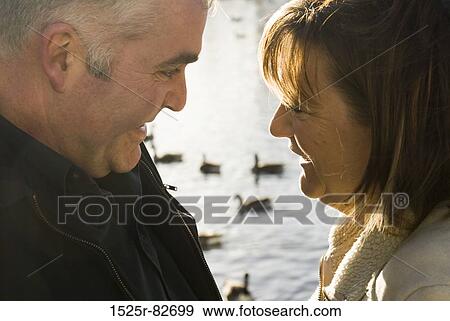 Mature couple looking at each other and smiling View Large Photo Image Stock Photo - Mature couple looking at each other and smiling. Fotosearch