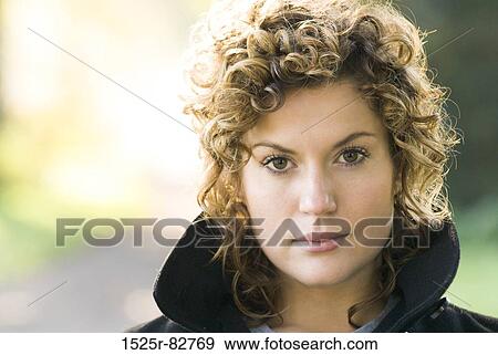 Portrait of a young woman thinking View Large Photo Image Stock Photo - Portrait of a young woman thinking. Fotosearch