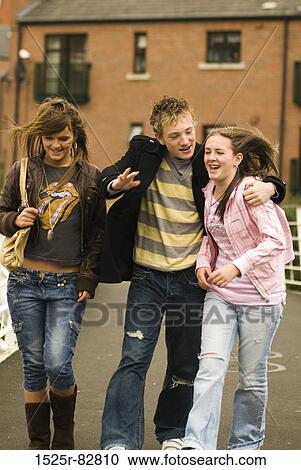 Teenage boy with two teenage girls walking together View Large Photo Image Stock Image - Teenage boy with two teenage girls walking together. Fotosearch