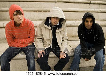 Stock Photography - Teenage boys sitting on steps. Fotosearch