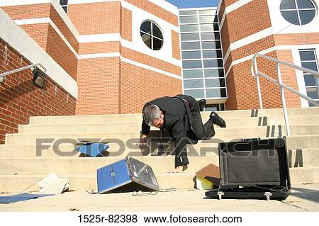 Stock Photo - Businessman falling down steps. Fotosearch