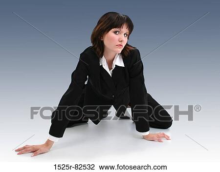 Businesswoman crouching on the floor View Large Photo Image Stock Image - Businesswoman crouching on the floor. Fotosearch