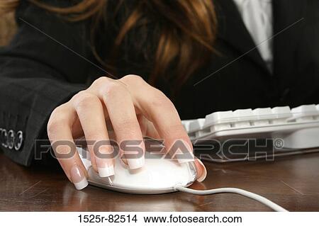 Businesswoman operating a computer mouse View Large Photo Image Picture - Businesswoman operating a computer mouse. Fotosearch