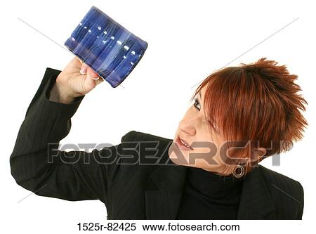 Stock Photography - Businesswoman peering into an empty coffee cup. Fotosearch