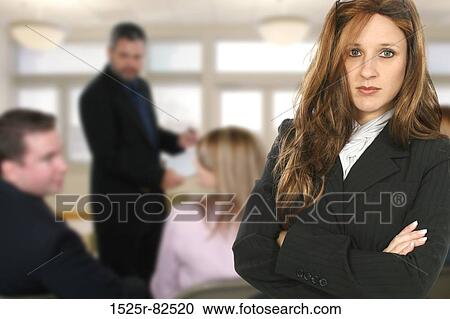 Businesswoman standing with her arms crossed View Large Photo Image Stock Image - Businesswoman standing with her arms crossed. Fotosearch