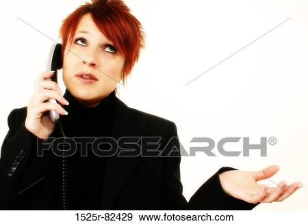 Close-up of a businesswoman talking on the telephone View Large Photo Image Stock Photo - Close-up of a businesswoman talking on the telephone. Fotosearch