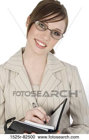 Close-up of a businesswoman writing in a personal organizer View Large Photo Image Stock Image - Close-up of a businesswoman writing in a personal organizer. Fotosearch