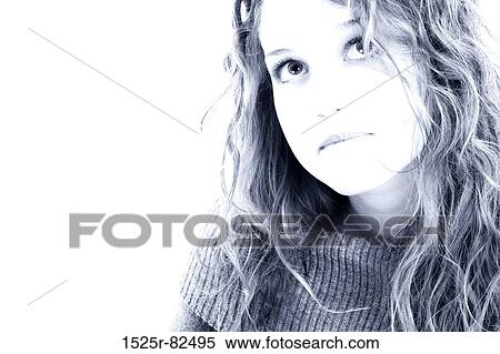 Close-up of a young woman looking serious View Large Photo Image Stock Photography - Close-up of a young woman looking serious. Fotosearch