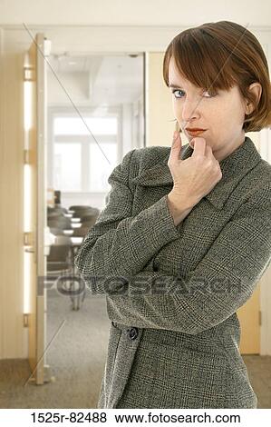 Mid adult woman looking serious View Large Photo Image Stock Photo - Mid adult woman looking serious. Fotosearch