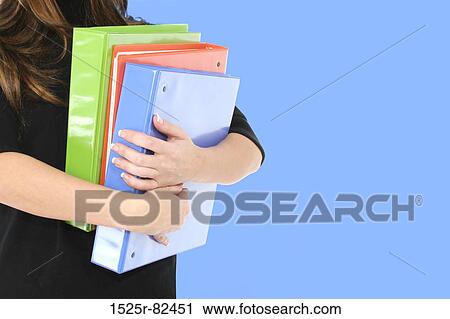 Mid section view of a businesswoman carrying notebooks View Large Photo Image Stock Image - Mid section view of a businesswoman carrying notebooks. Fotosearch