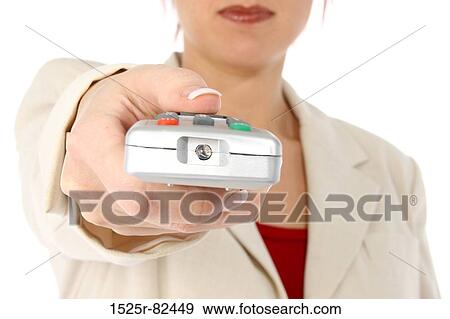 Stock Photo - Mid section view of a woman operating a remote control. Fotosearch