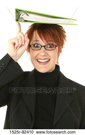 Portrait of a businesswoman balancing a notebook on her head View Large Photo Image Stock Image - Portrait of a businesswoman balancing a notebook on her head. Fotosearch
