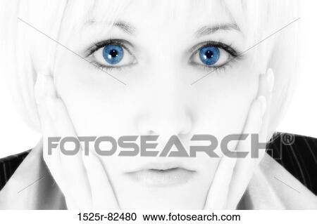 Stock Image - Portrait of a mid adult woman looking serious. Fotosearch