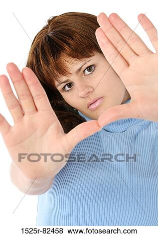 Portrait of a mid adult woman making a gesture View Large Photo Image Stock Photo - Portrait of a mid adult woman making a gesture. Fotosearch