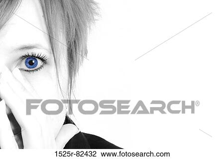 Stock Image - Portrait of a mid adult woman with her hands over her mouth. Fotosearch