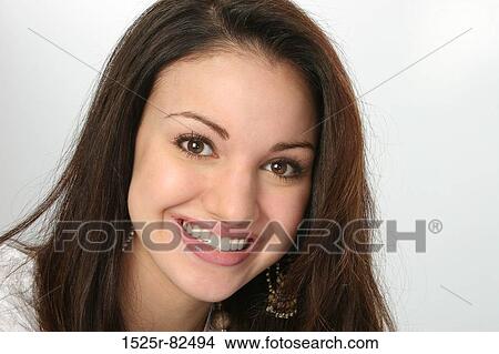 Portrait of a young woman smiling View Large Photo Image Picture - Portrait of a young woman smiling. Fotosearch