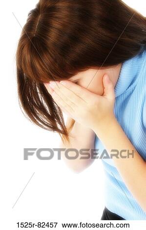 Young woman covering her face with her hands View Large Photo Image Stock Photo - Young woman covering her face with her hands. Fotosearch