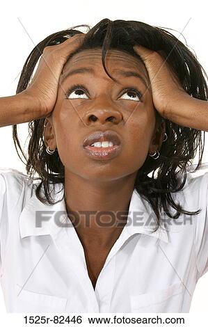 Young woman suffering from a headache View Large Photo Image Stock Photograph - Young woman suffering from a headache. Fotosearch