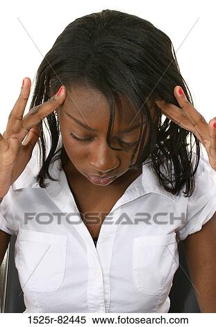 Young woman suffering from a headache View Large Photo Image Stock Photography - Young woman suffering from a headache. Fotosearch