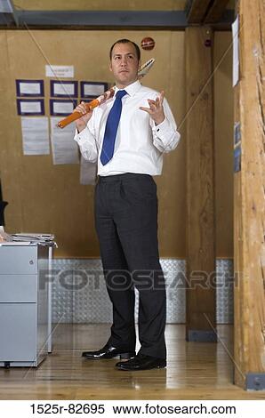 Businessman holding a cricket bat and tossing a cricket ball in the air View Large Photo Image Stock Photography - Businessman holding a cricket bat and tossing a cricket ball in the air. Fotosearch