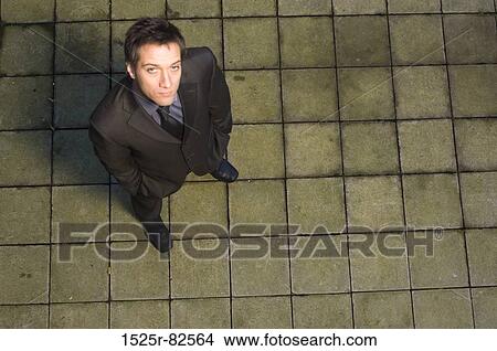 Picture - High angle view of a businessman looking up. Fotosearch