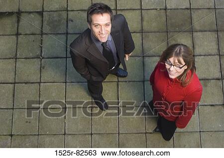 High angle view of a businessman standing with a businesswoman View Large Photo Image Stock Image - High angle view of a businessman standing with a businesswoman. Fotosearch
