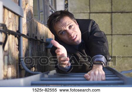 High angle view of a businessman standing on a ladder and raising his hand View Large Photo Image Stock Photography - High angle view of a businessman standing on a ladder and raising his hand. Fotosearch