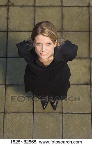 Stock Photography - High angle view of a businesswoman looking up. Fotosearch