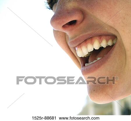 Beautiful woman shows off her pearly whites against a white background View Large Photo Image Stock Image - Beautiful woman shows off her pearly whites against a white background. Fotosearch