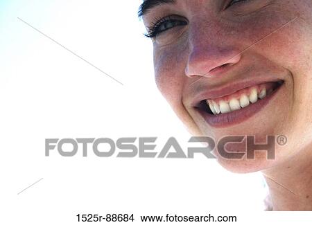 Beautiful woman with blue eyes smiles View Large Photo Image Picture - Beautiful woman with blue eyes smiles. Fotosearch