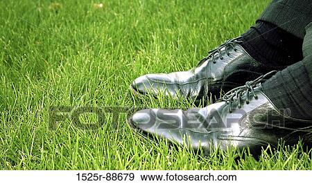 Black, shining business shoes in the green grass View Large Photo Image Stock Photo - Black, shining business shoes in the green grass. Fotosearch